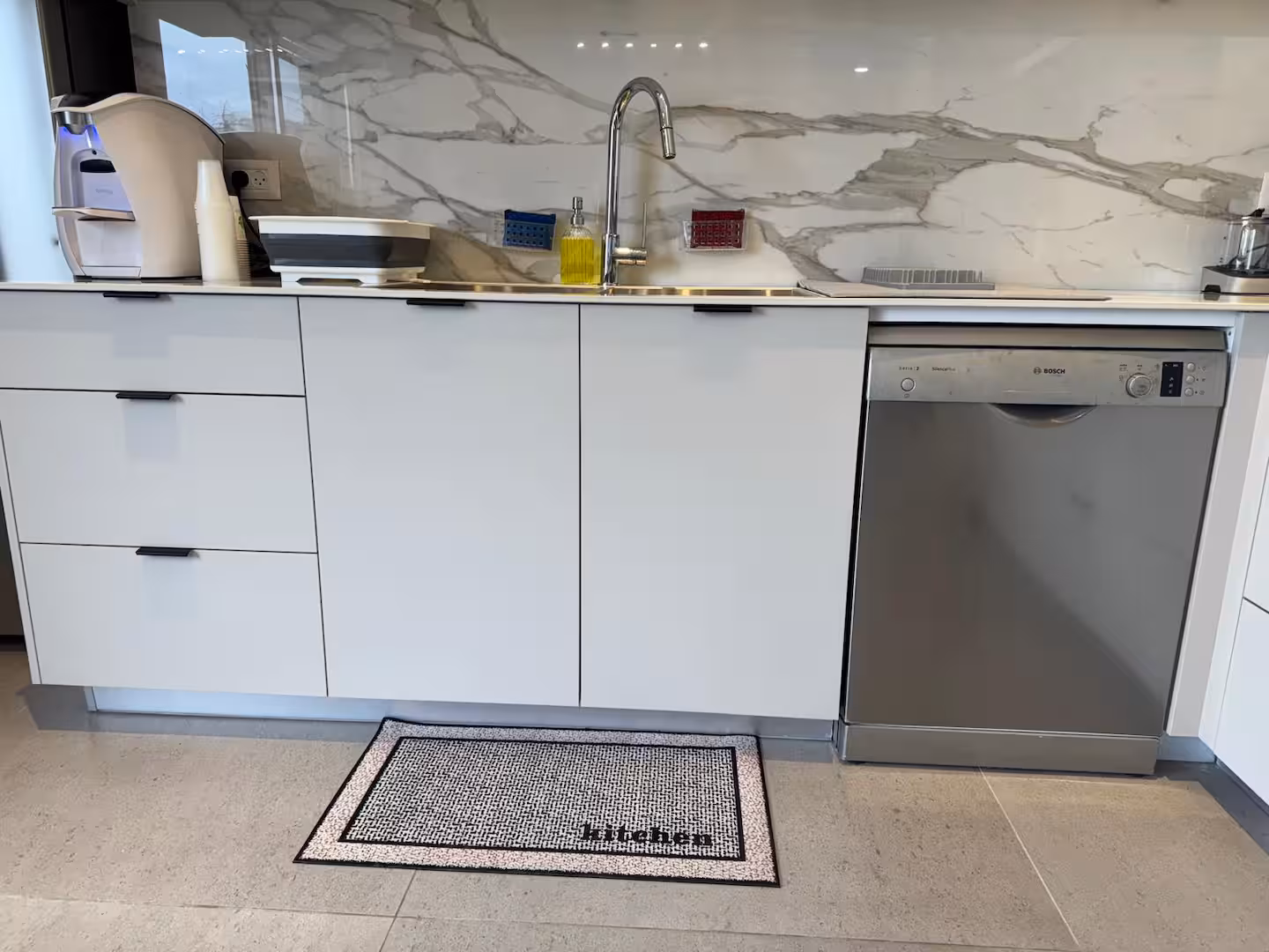 Kitchen with marble backsplash